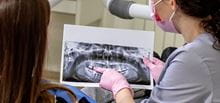 Dentist explaining X-ray to patient